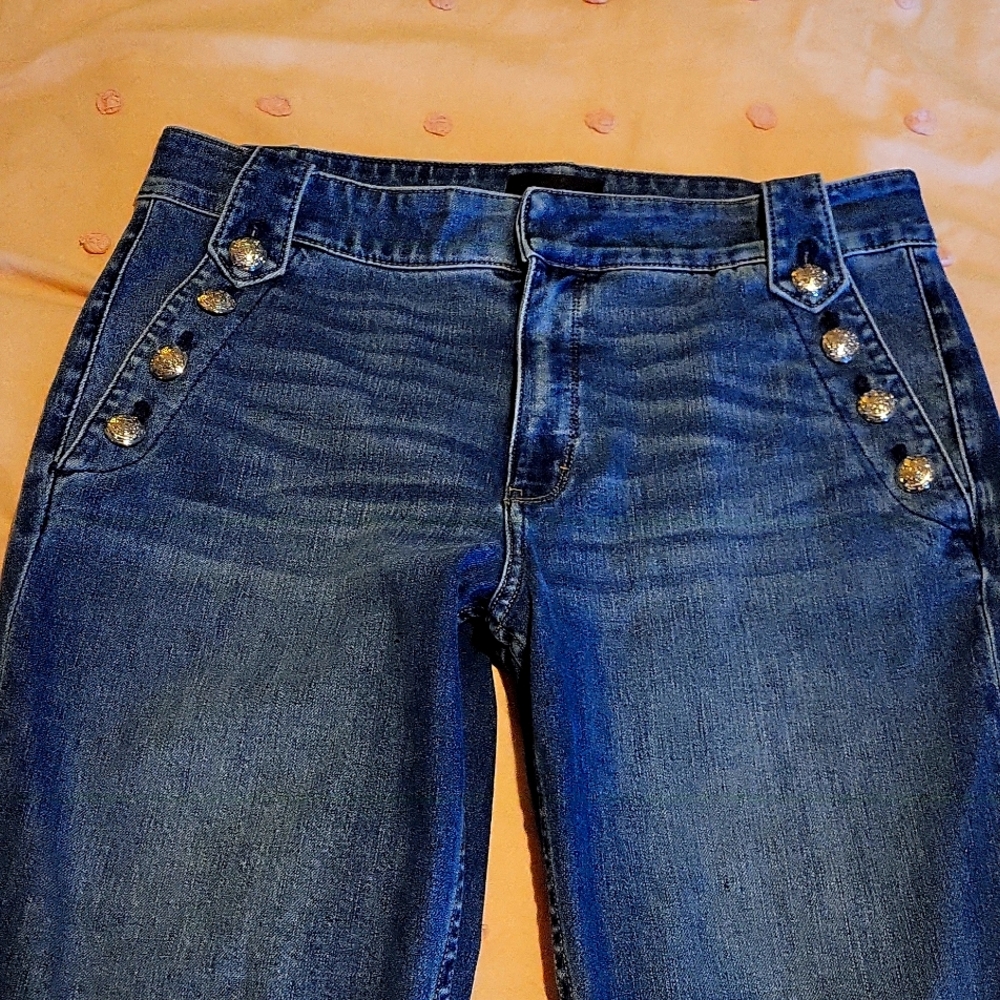 White house black market jeans with adorning silver buttons!